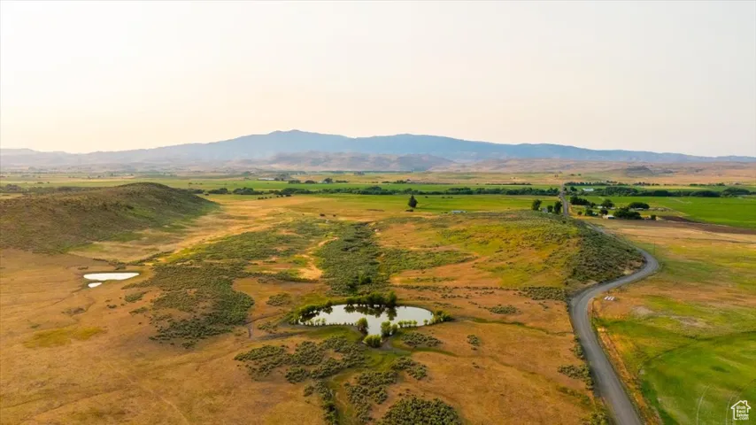 Aerial overview of property's location featuring a water and mountain view