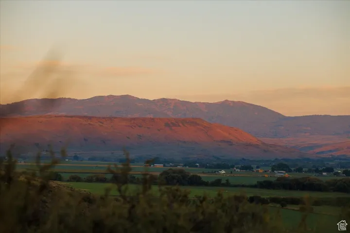 View of mountain background featuring rural landscape