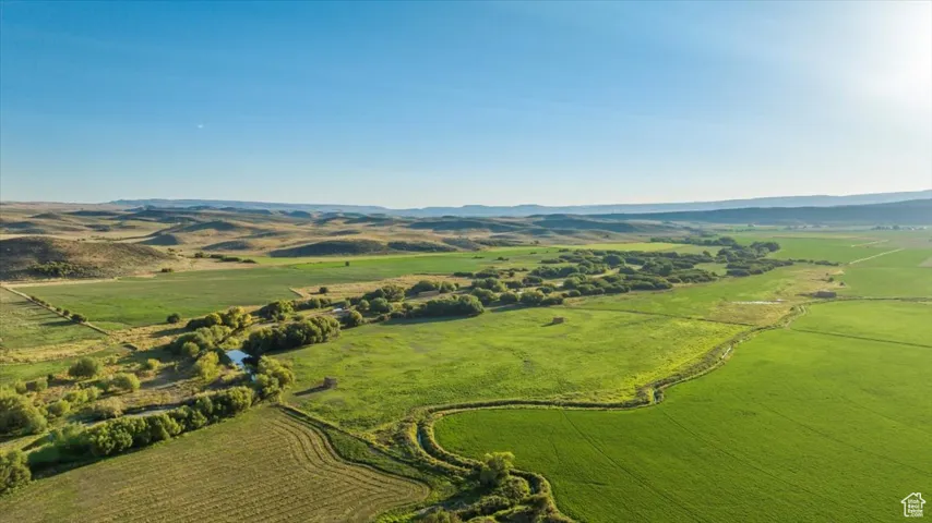 Overview of rural landscape featuring a mountain backdrop