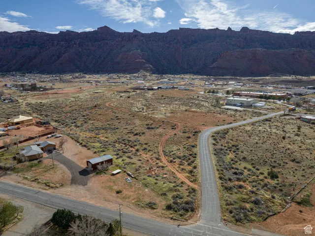 Aerial overview of property's location with mountains and rural landscape