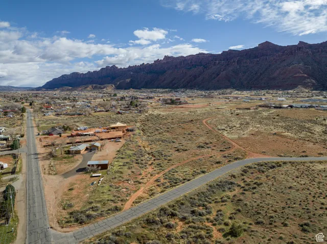 View of rural area featuring a mountainous background and a desert landscape