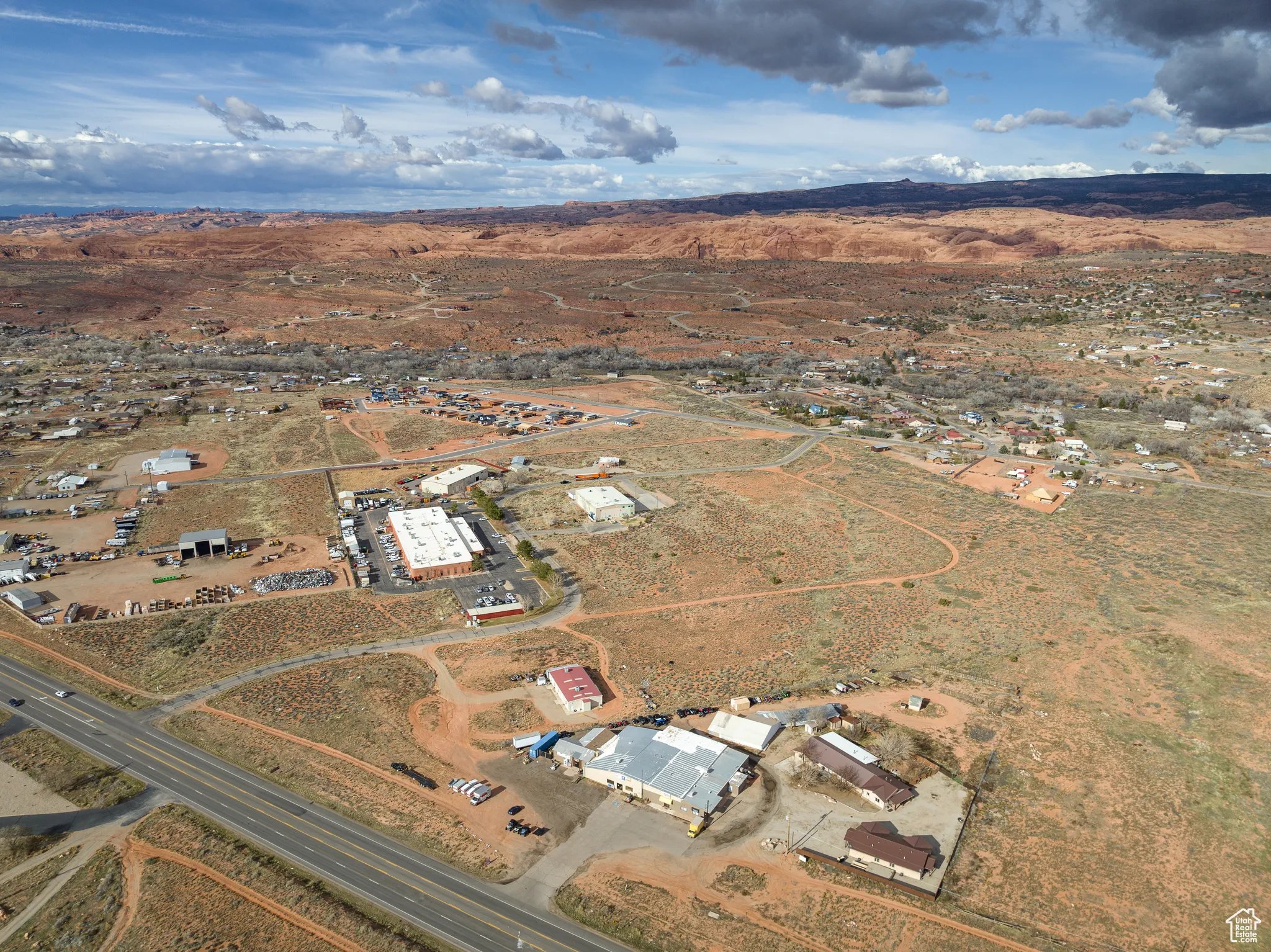 Aerial view of property and surrounding area featuring rural landscape and a desert landscape