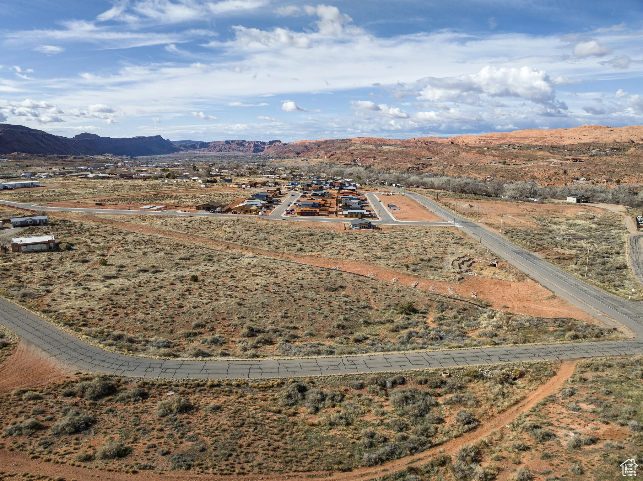 View of rural area with a desert landscape and a mountain backdrop