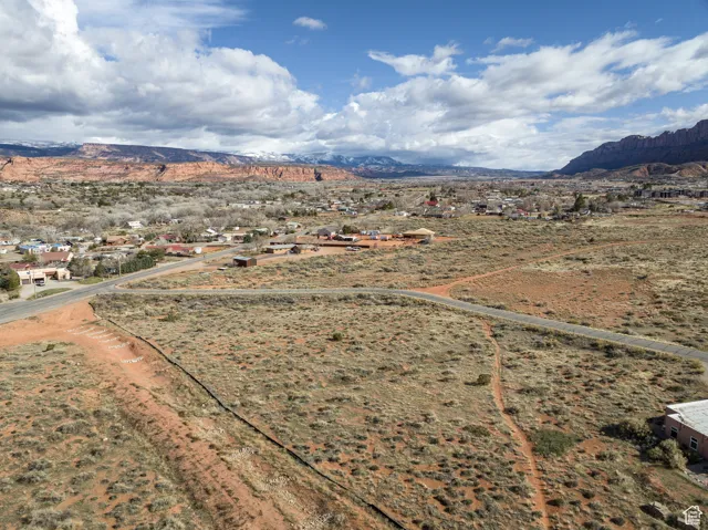 Overview of rural landscape with a mountain backdrop and a desert landscape