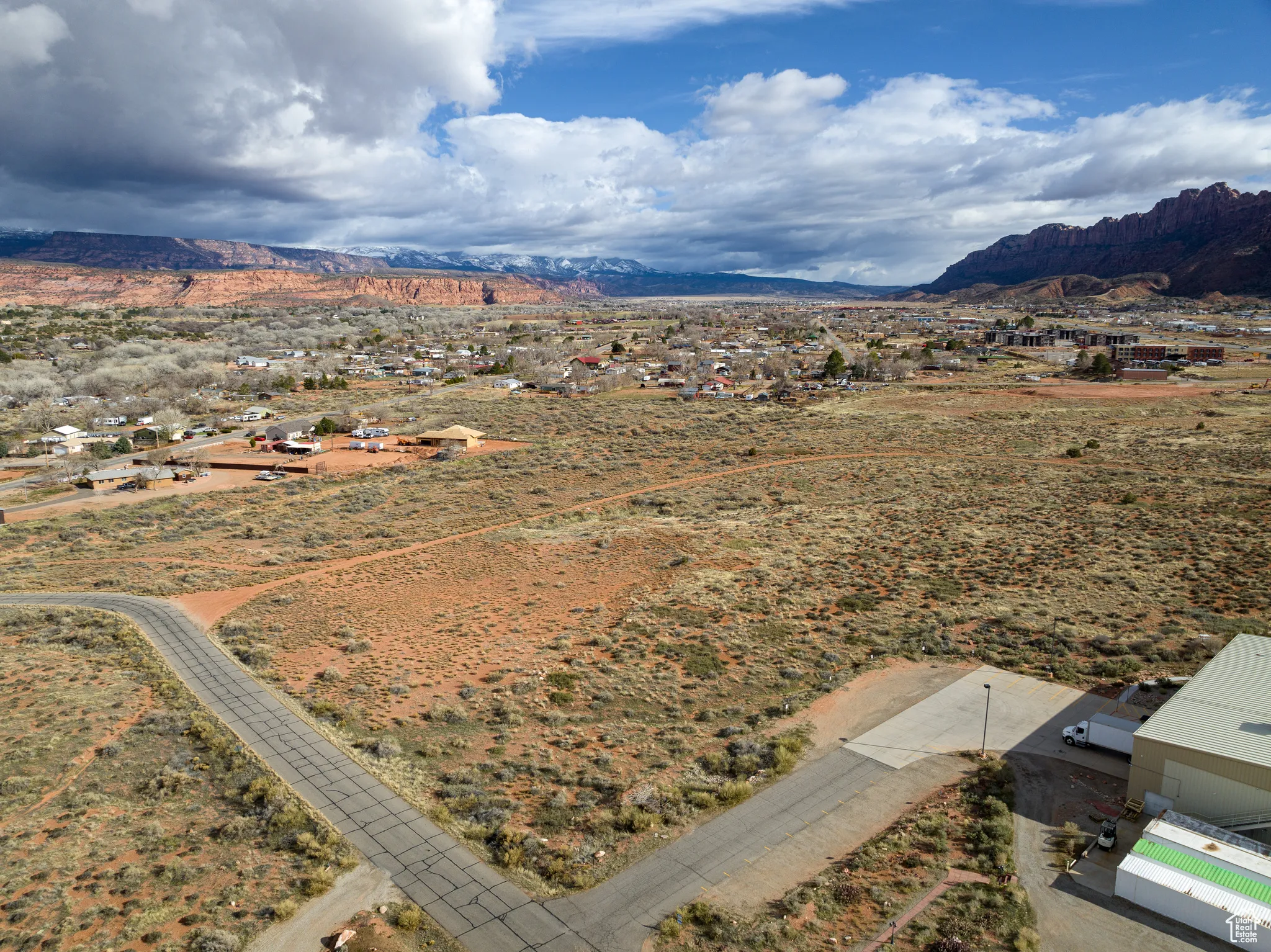 View of rural area with a mountain backdrop and a desert landscape