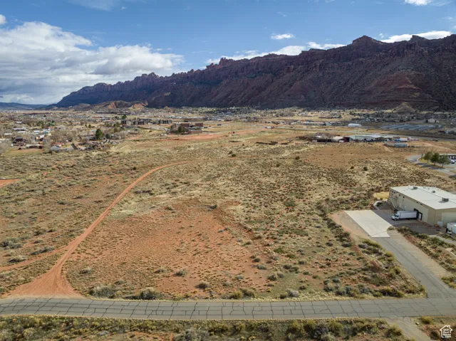View of mountain backdrop with rural landscape and a desert landscape