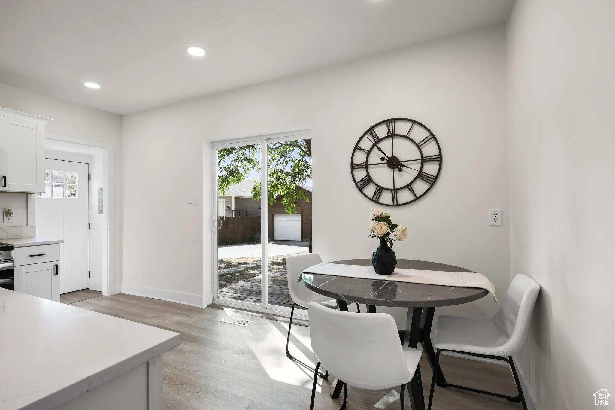 Dining space featuring recessed lighting and light wood-type flooring