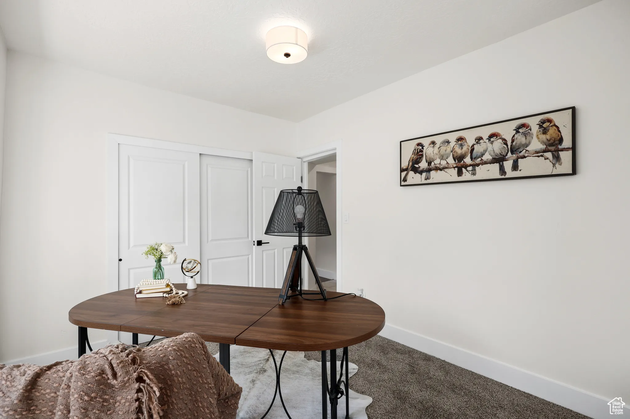 Carpeted office featuring baseboards