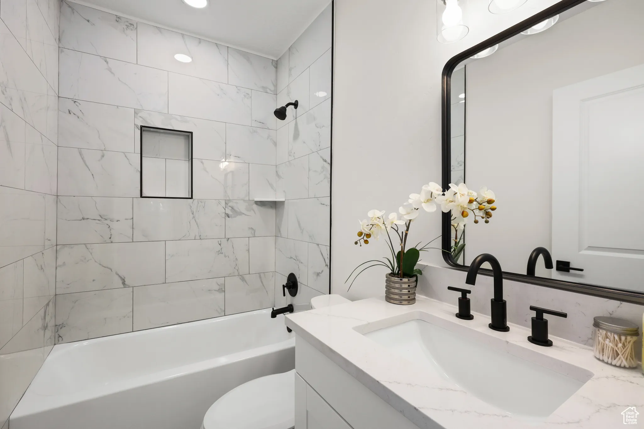 Bathroom with bathtub / shower combination and vanity