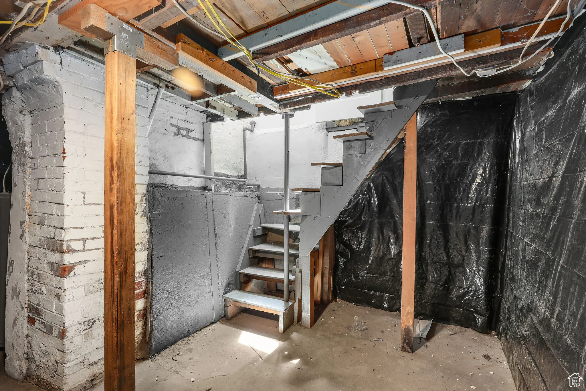 Unfinished below grade area with stairs