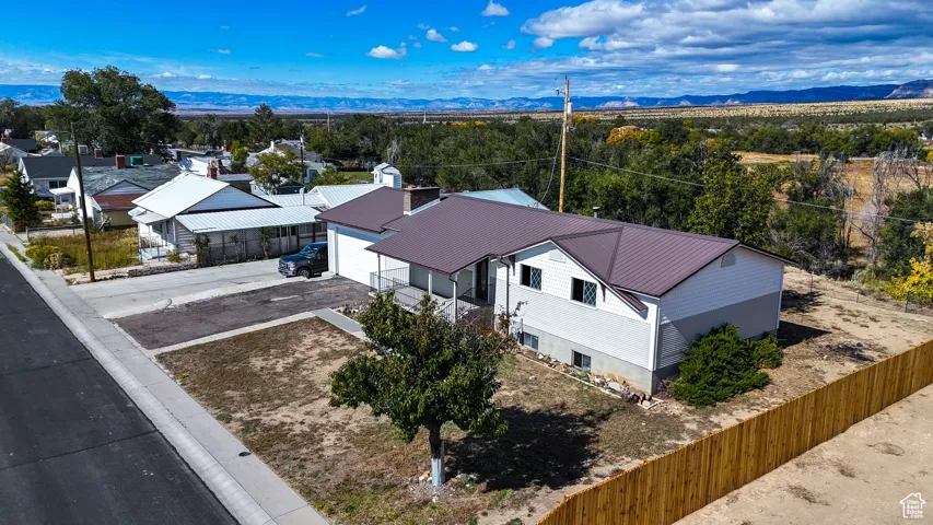 Aerial view of residential area featuring mountains