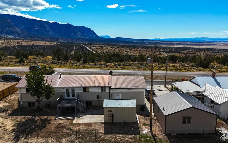 View of subject property with mountains