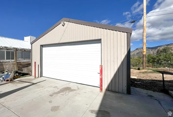 Detached garage featuring a mountain view