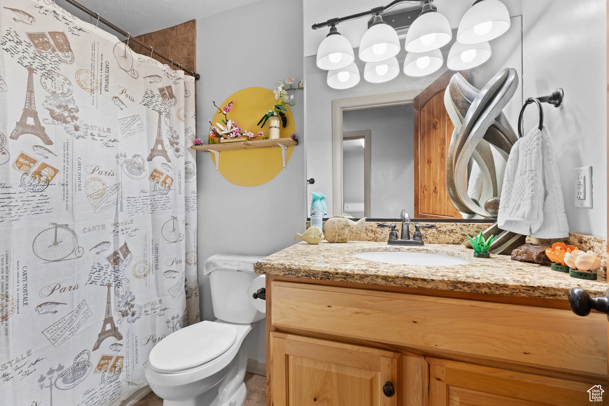 Full bath featuring vanity and curtained shower
