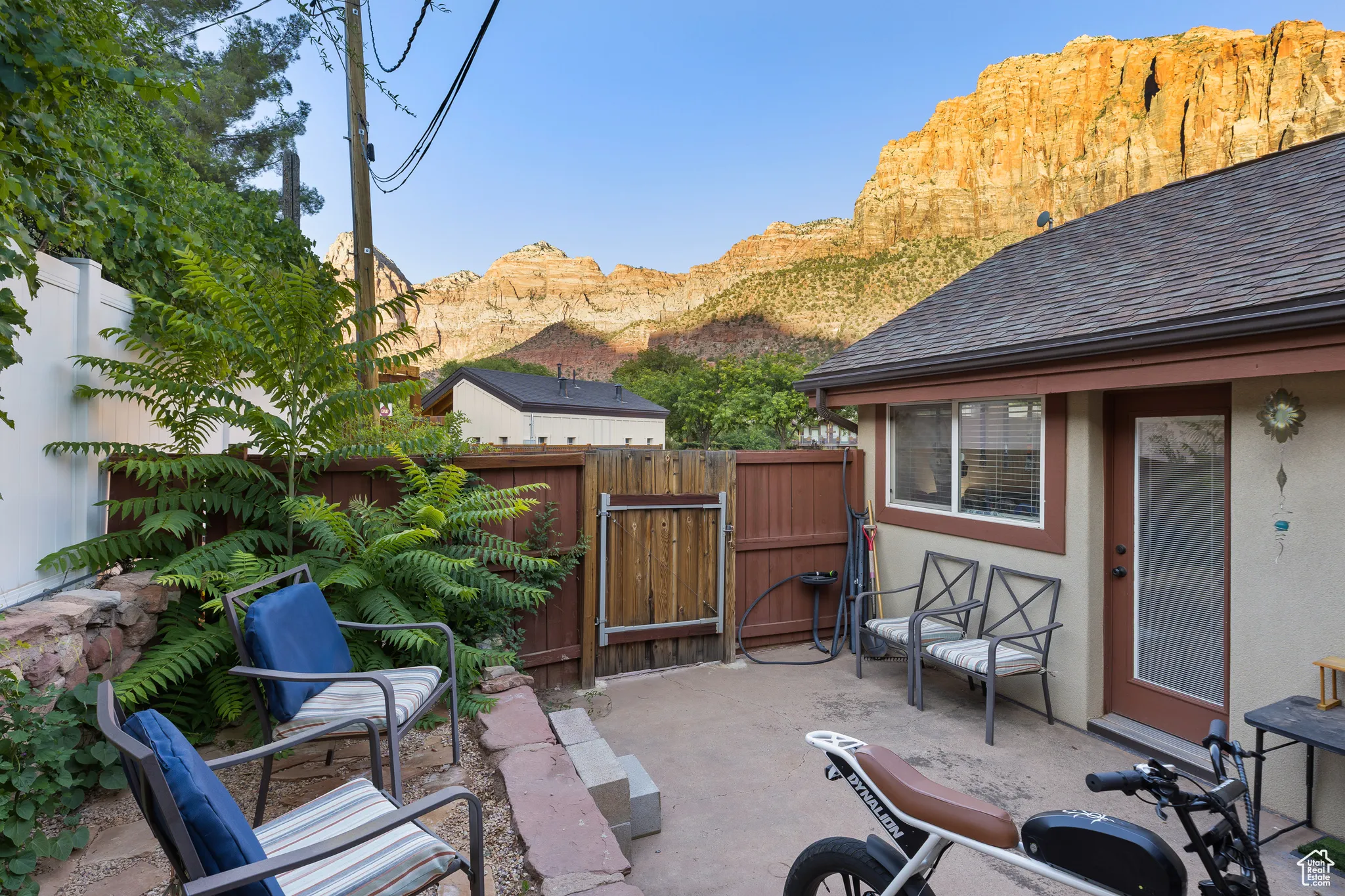 View of patio featuring a gate and a mountain view