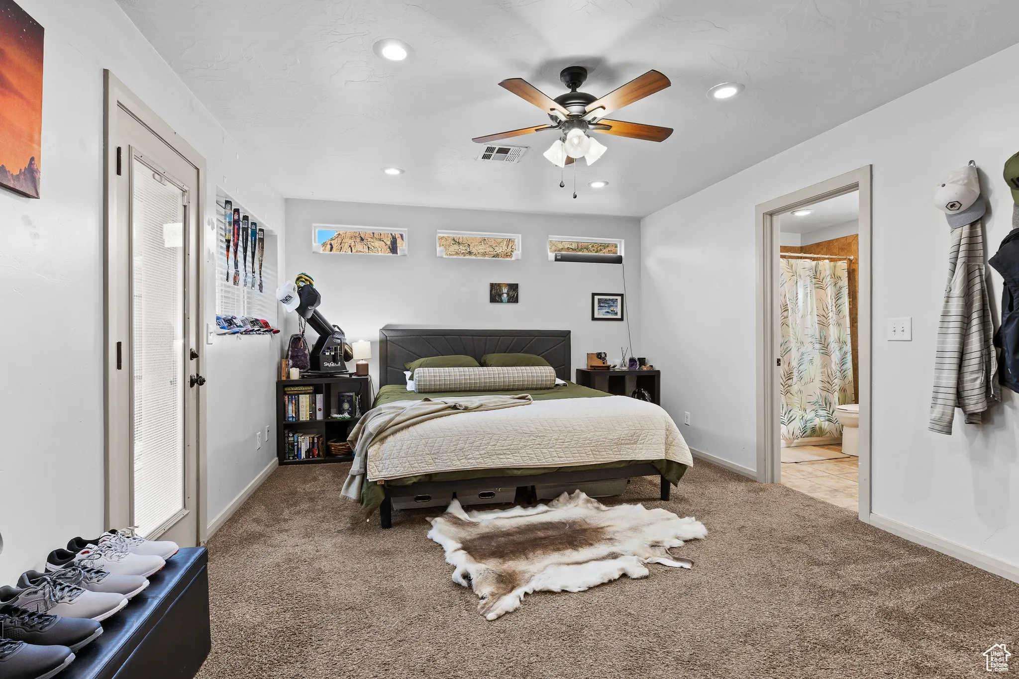 Bedroom with carpet floors, recessed lighting, ensuite bathroom, and a ceiling fan