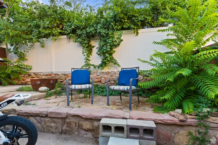 Fenced backyard featuring a patio area