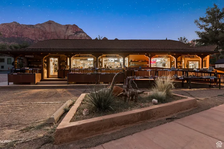 View of front of property featuring covered porch, roof with shingles, and a mountain view