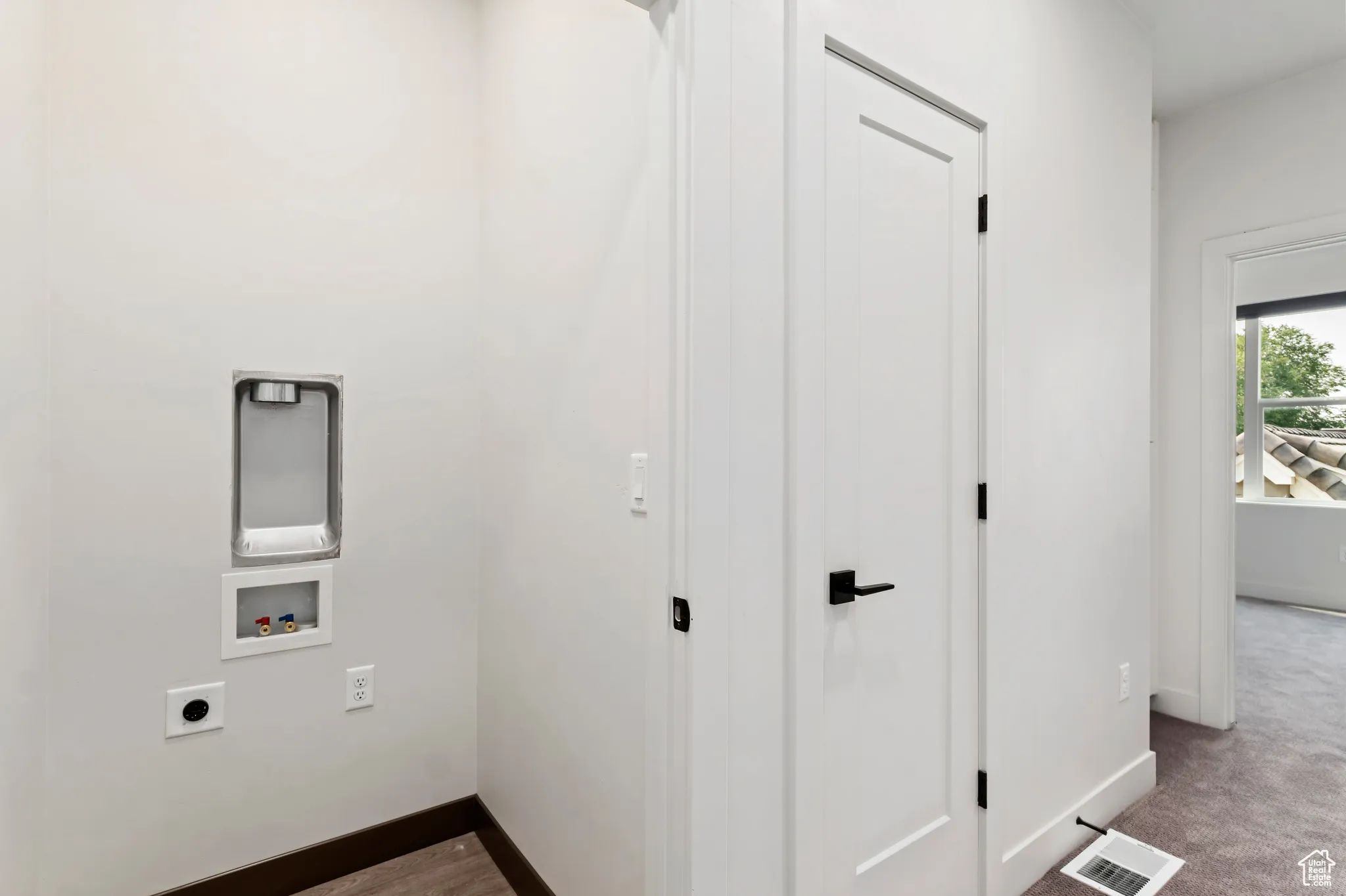 Laundry area featuring hookup for a washing machine, hookup for an electric dryer, and carpet floors