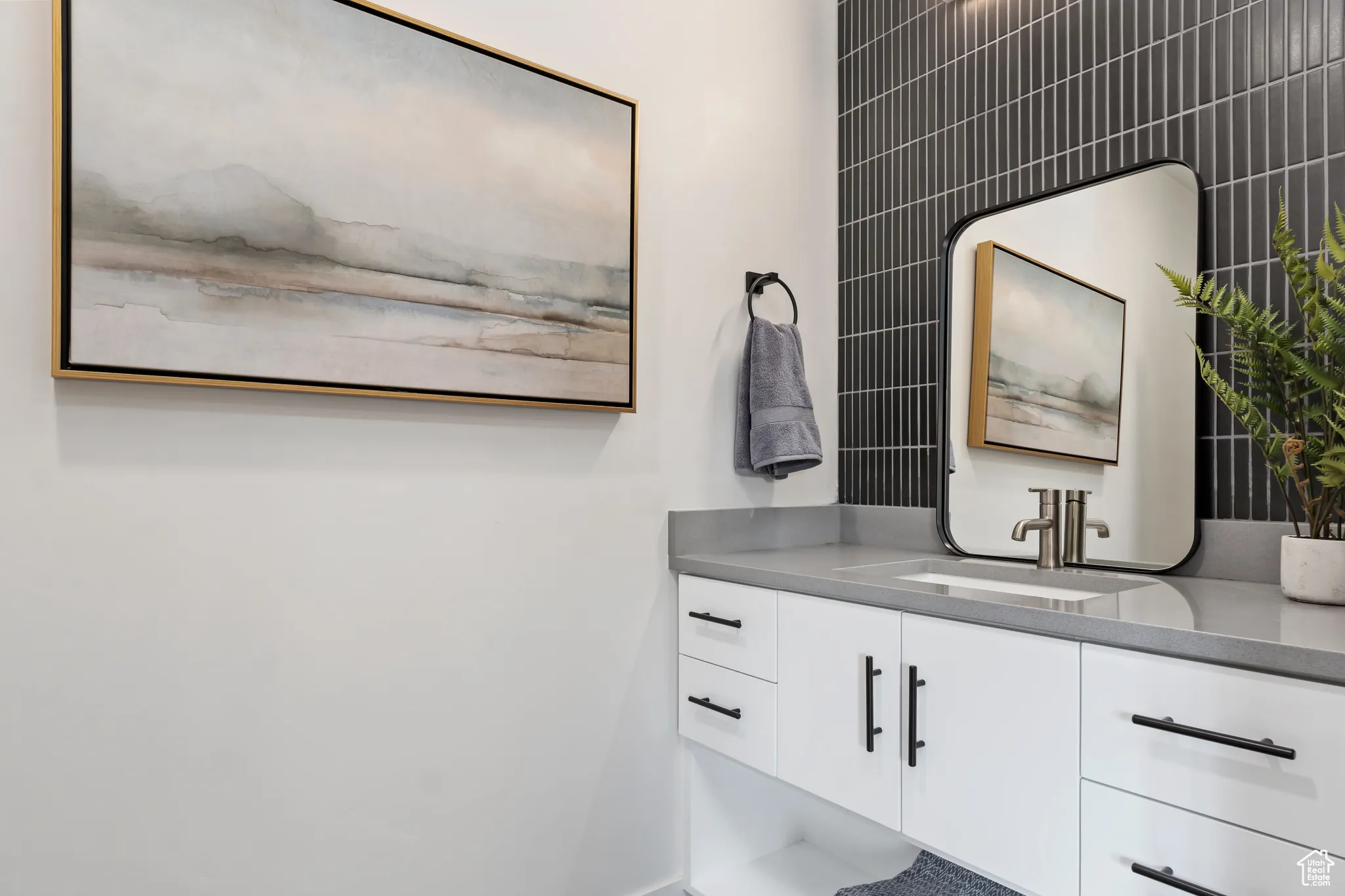Bathroom with vanity and baseboards