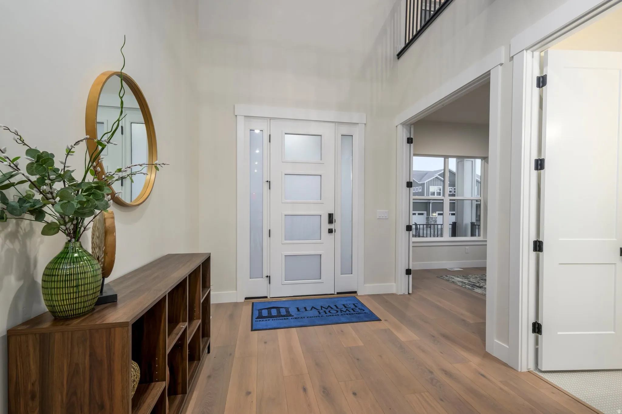 Entrance foyer with wood finished floors and baseboards