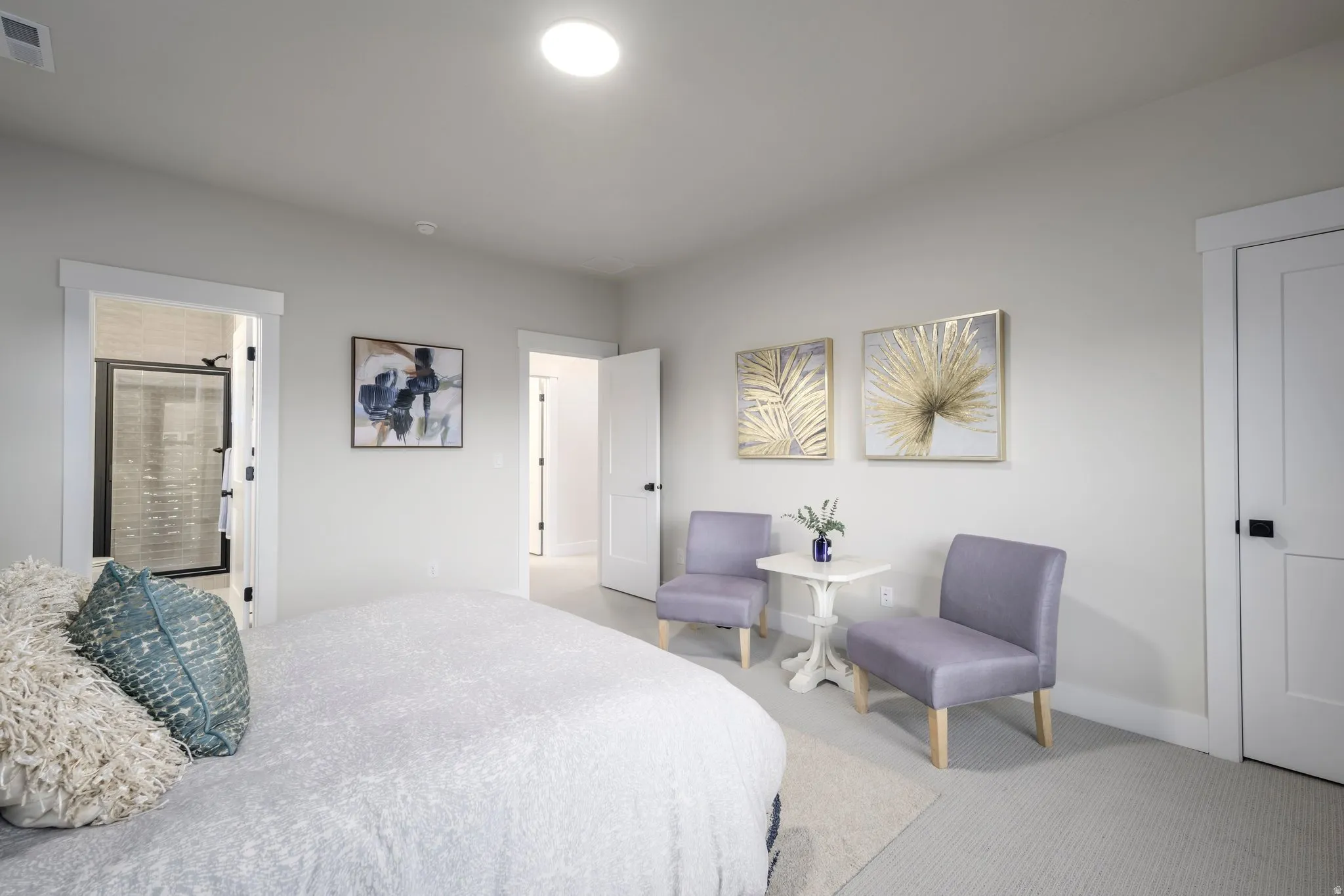 Bedroom featuring carpet floors and ensuite bath