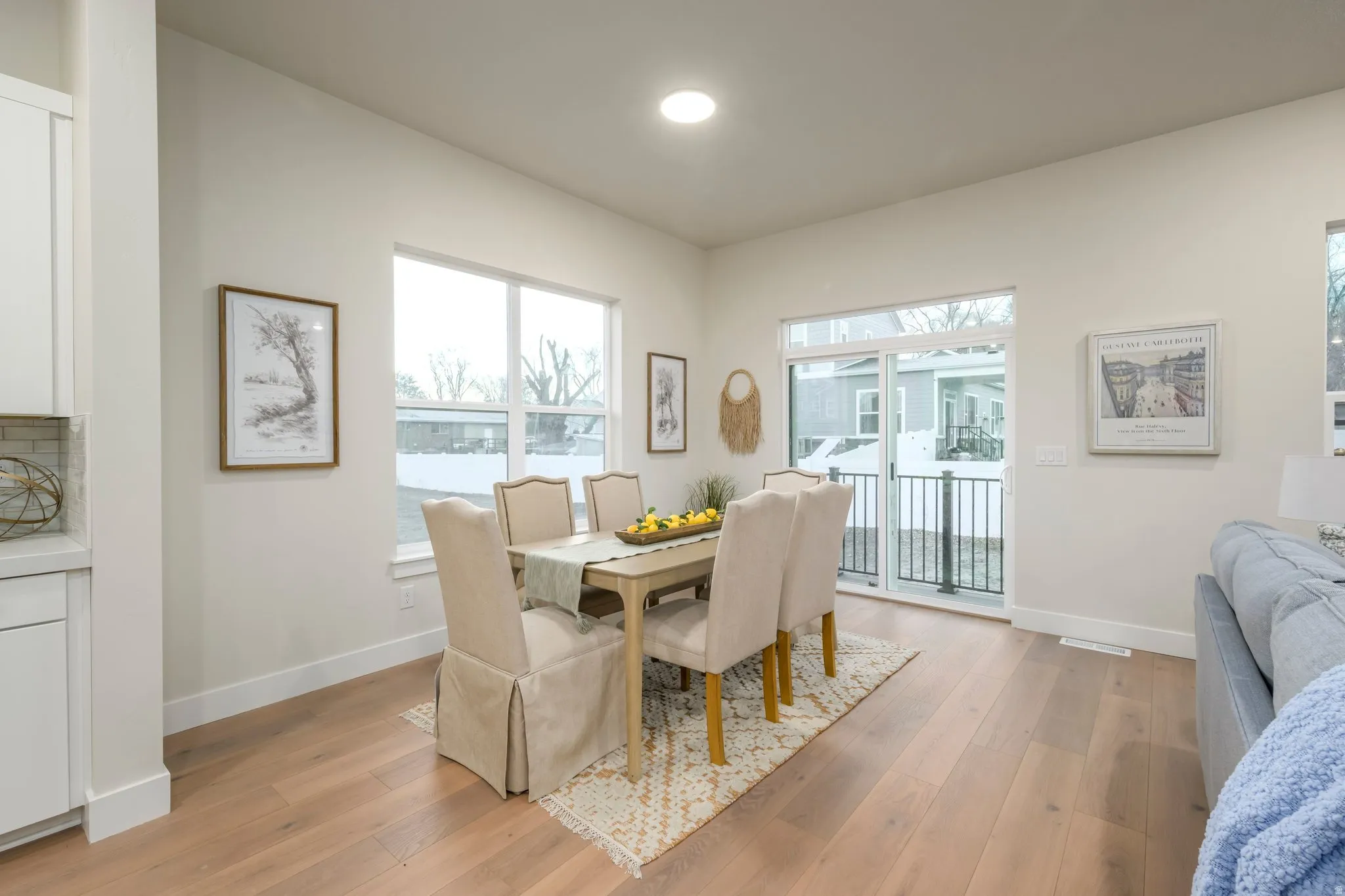 Dining space with baseboards and light wood-style floors