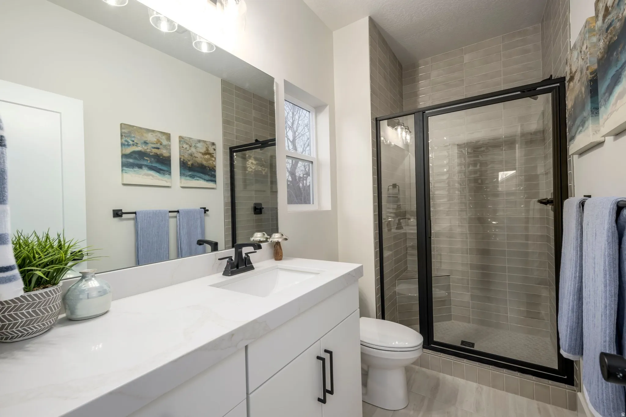 Bathroom featuring vanity and a stall shower