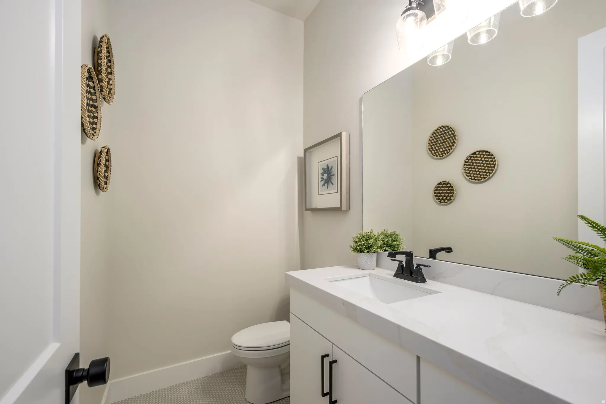Bathroom with vanity and tile patterned flooring