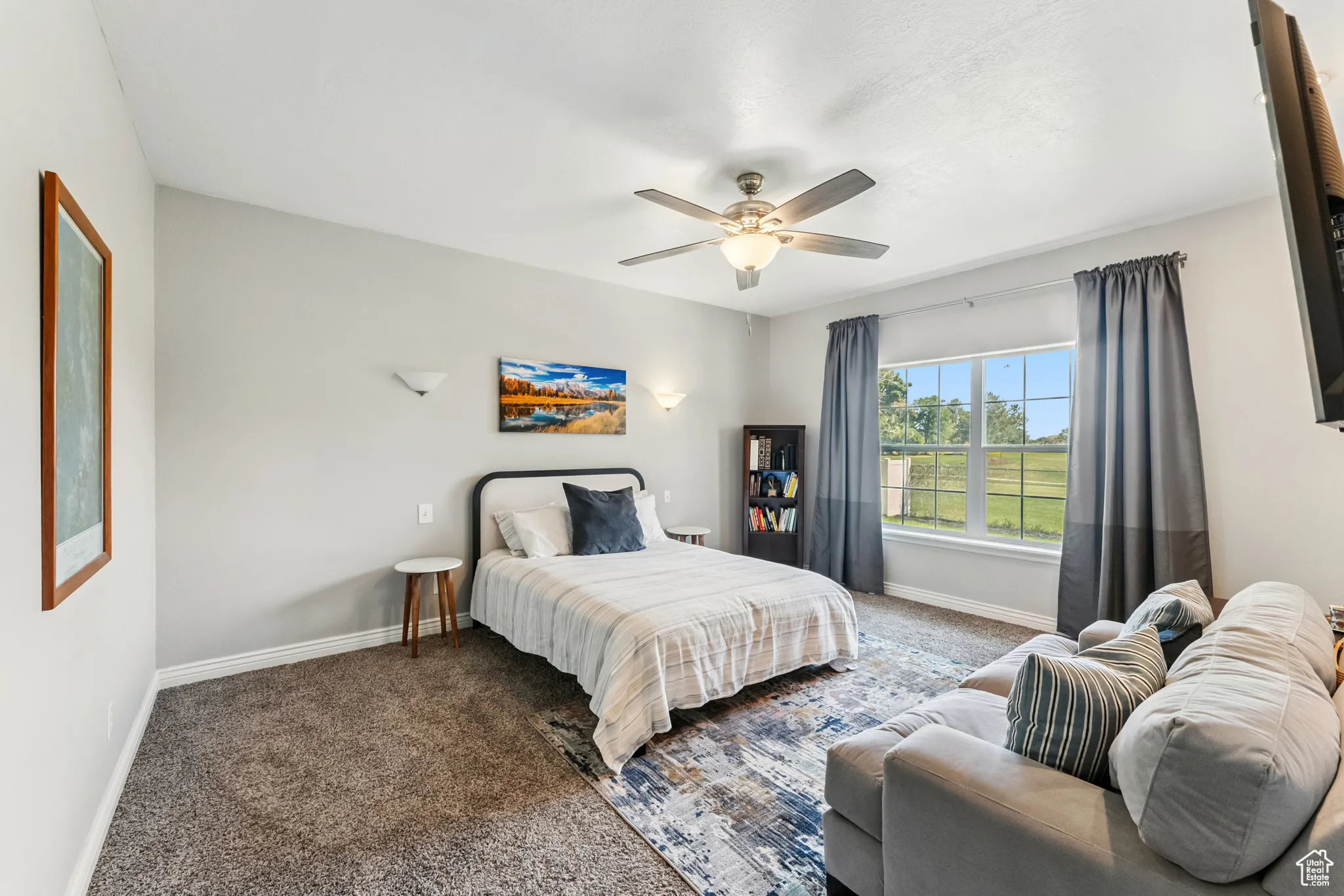 Bedroom featuring carpet floors and ceiling fan