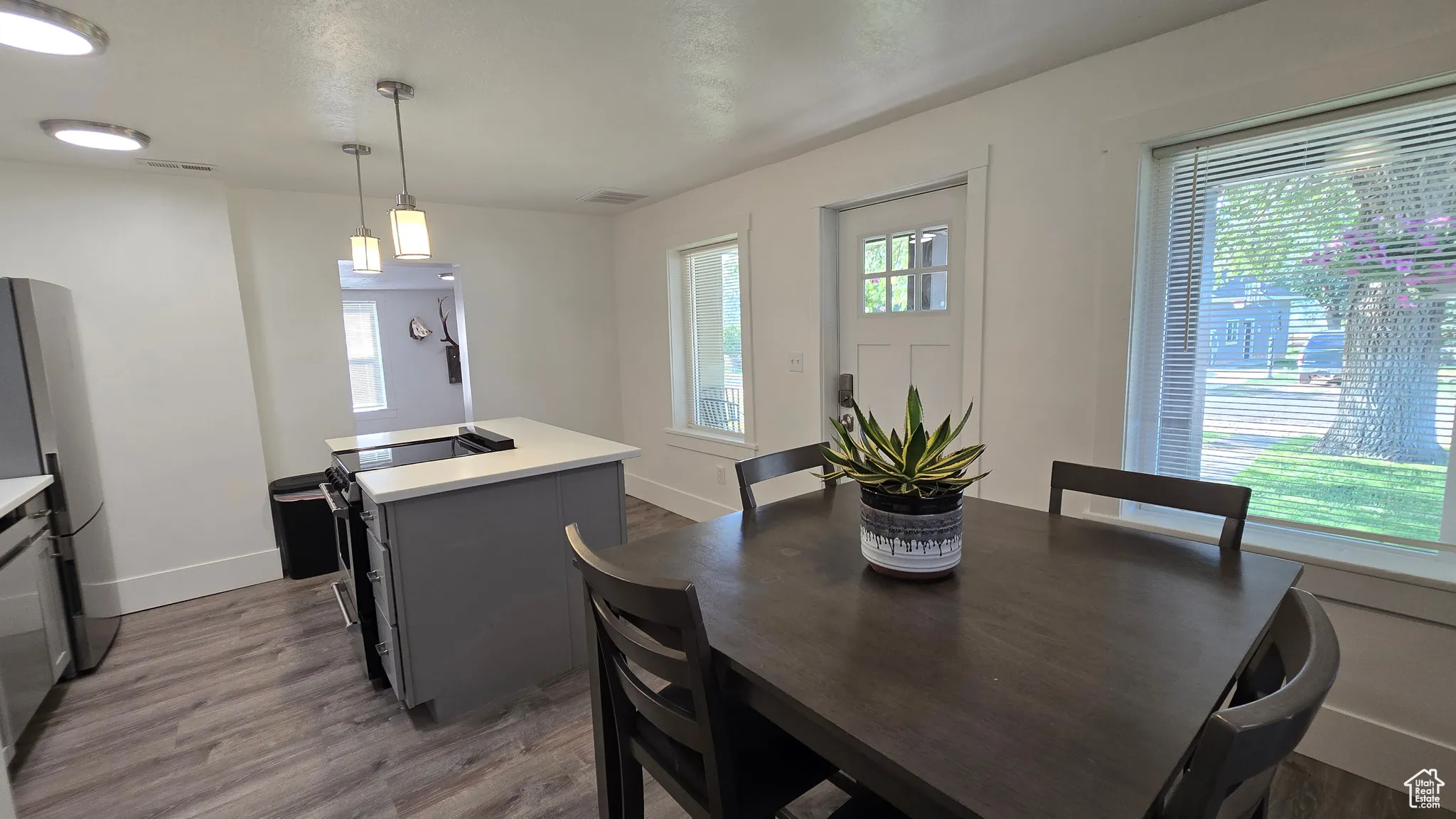 Dining room featuring wood finished floors and baseboards