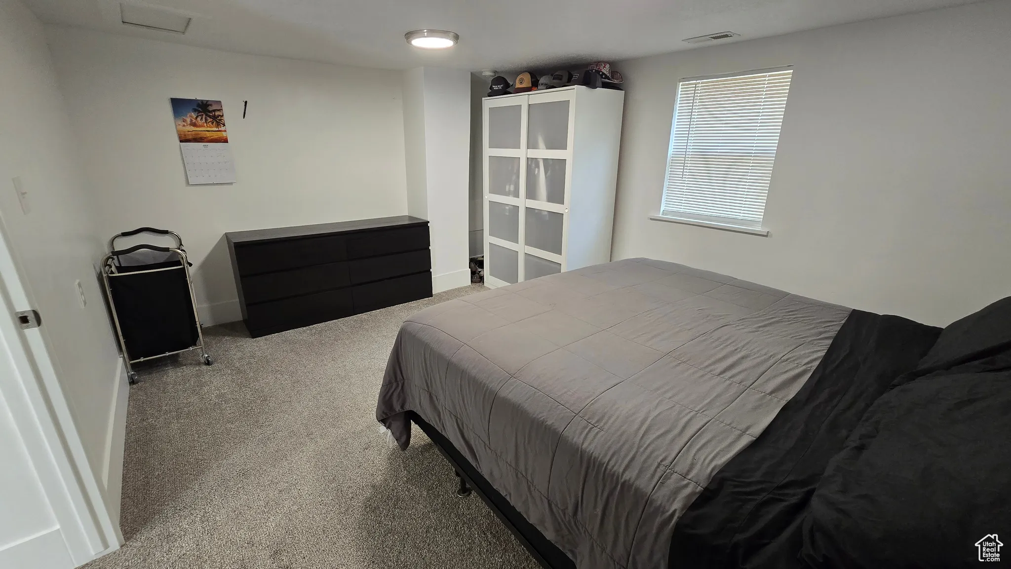 Carpeted bedroom with baseboards