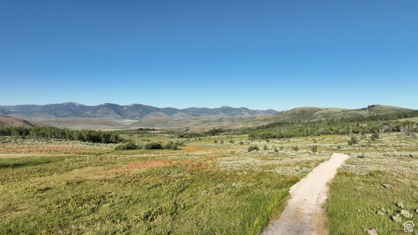 View of mountain background featuring rural landscape