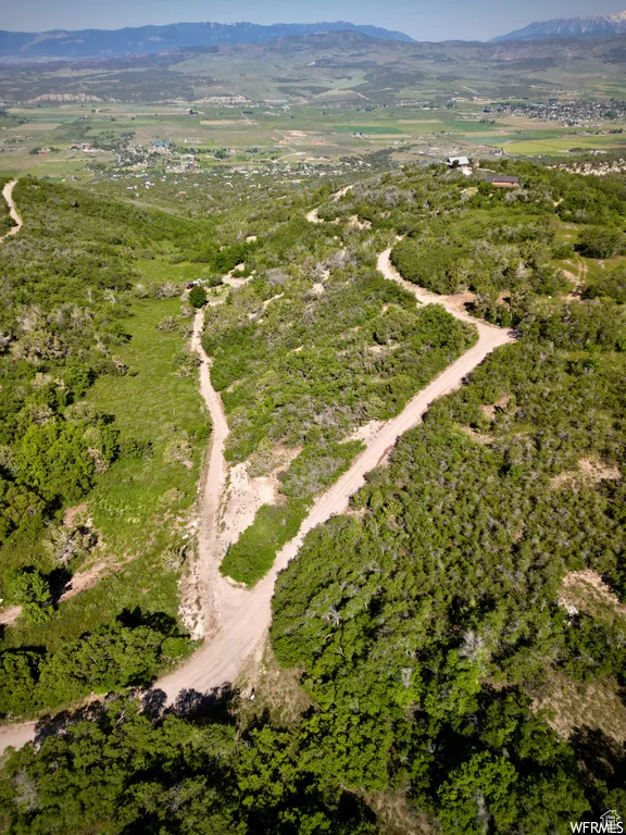 Aerial view of property's location featuring mountains