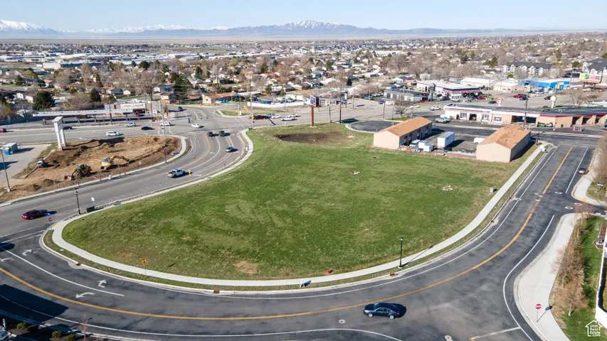 Aerial view of property's location with a mountain backdrop