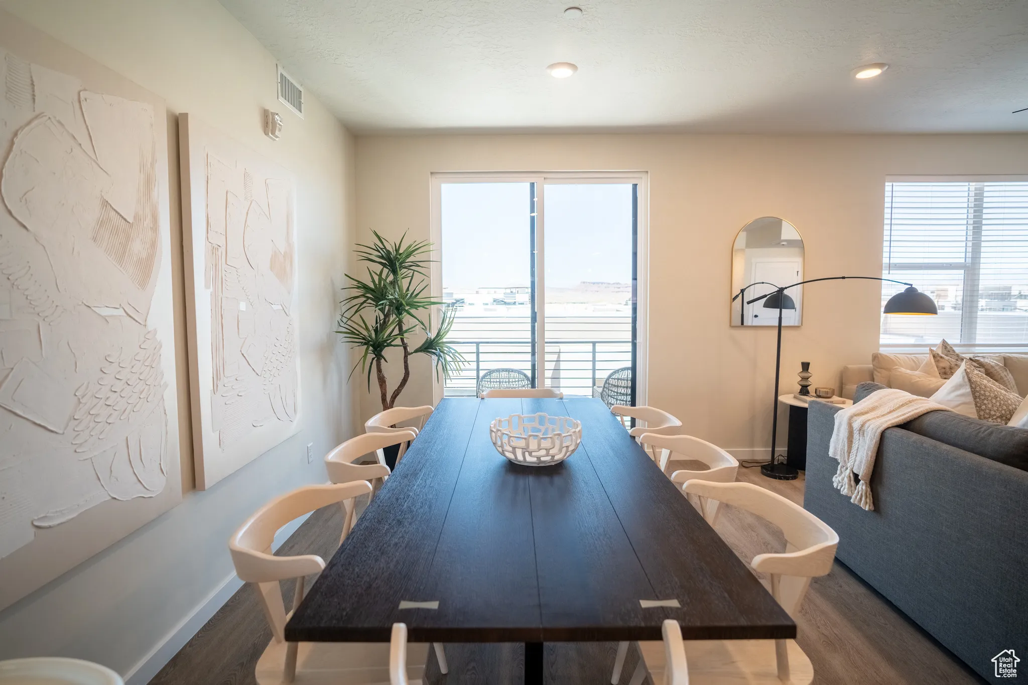 Dining area featuring wood finished floors and recessed lighting