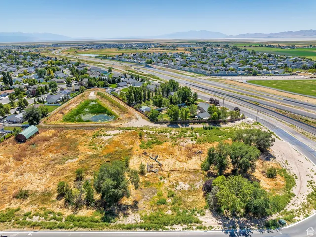 Aerial view of residential area featuring a mountainous background