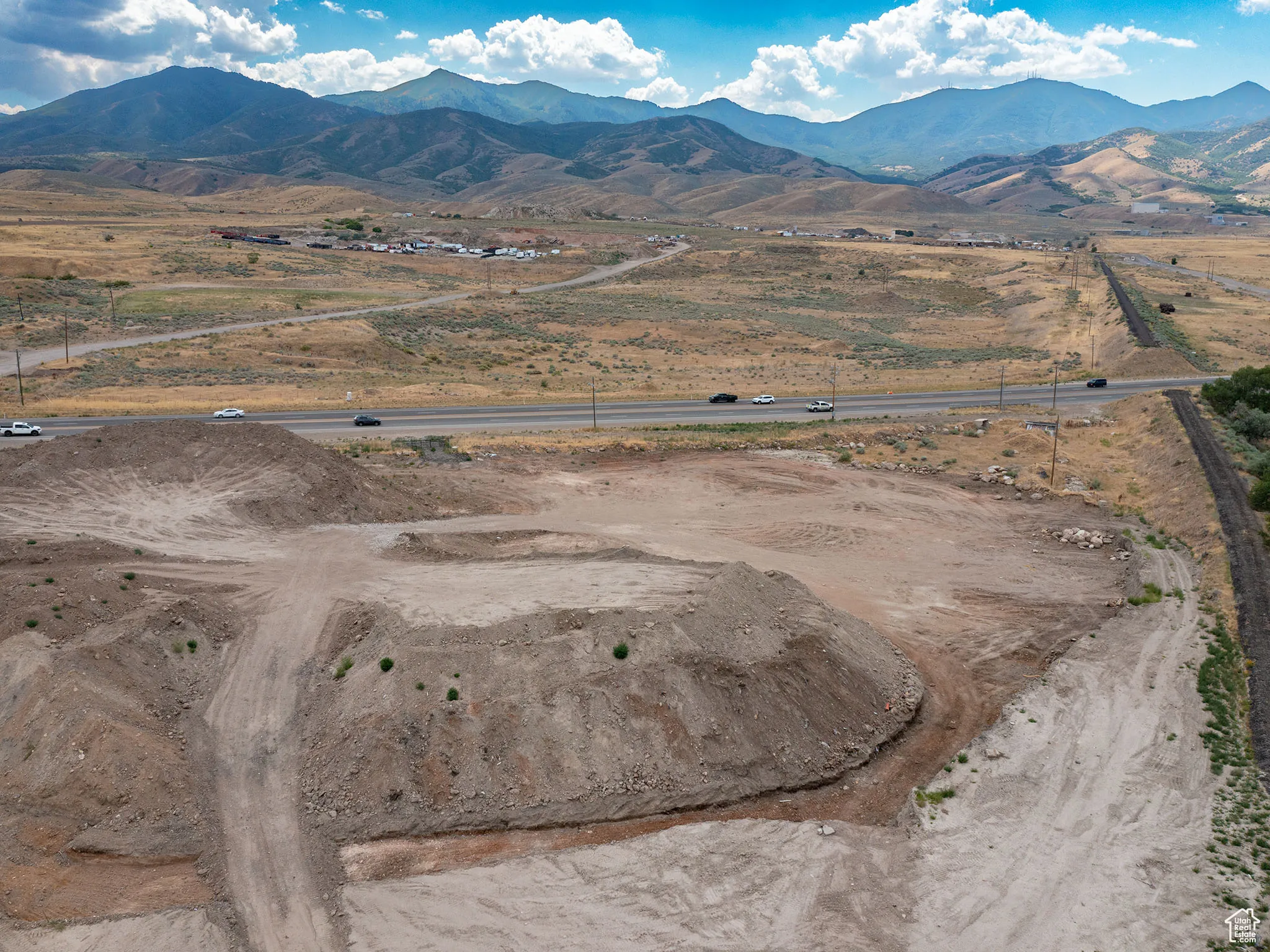 Aerial view of sparsely populated area with a mountainous background