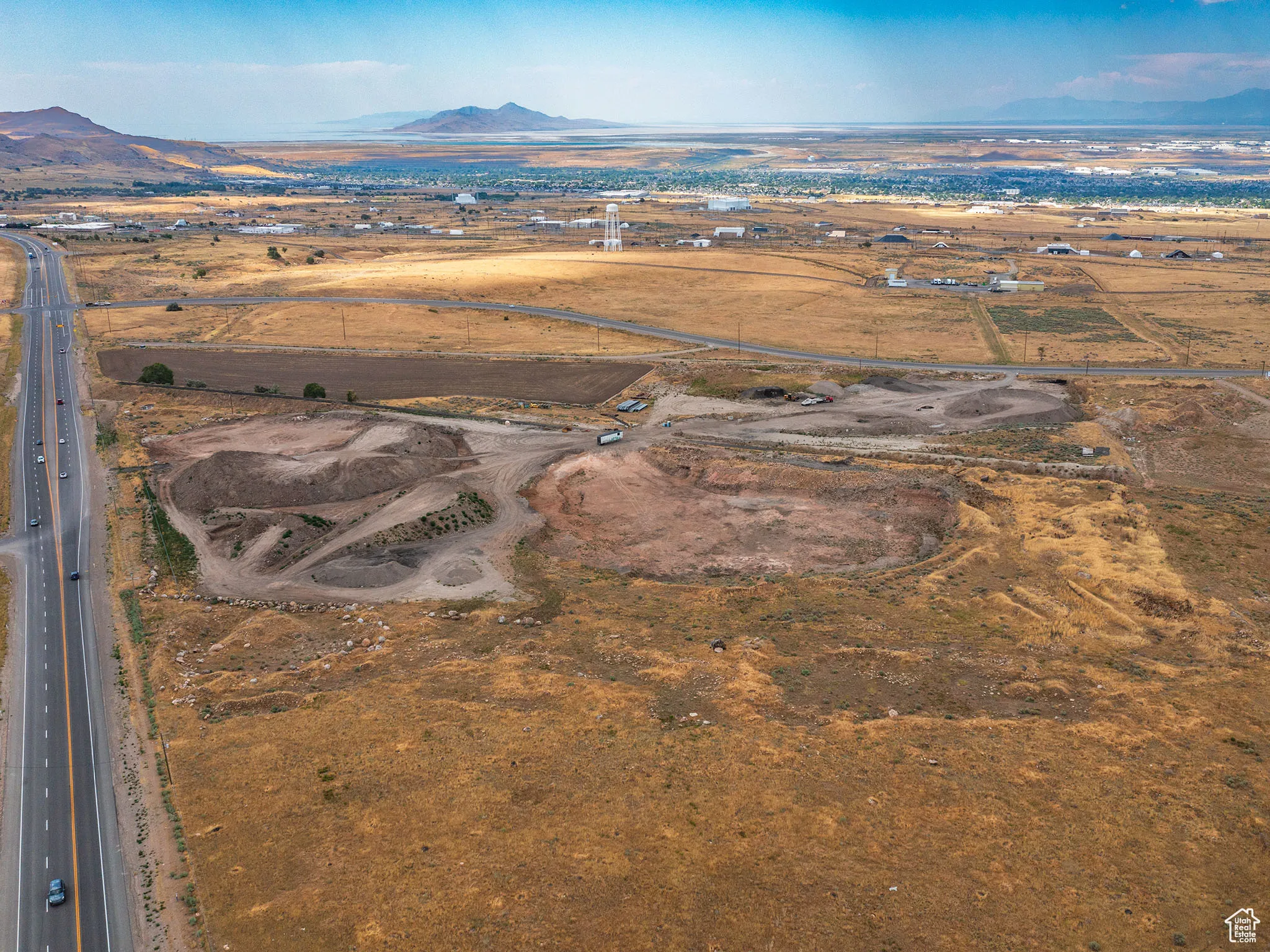 Aerial overview of property's location with rural landscape and mountains
