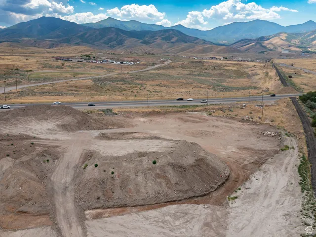 Aerial view of sparsely populated area with a mountainous background