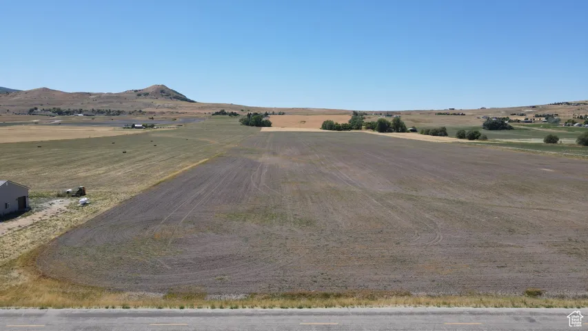 View of mountain backdrop with rural landscape