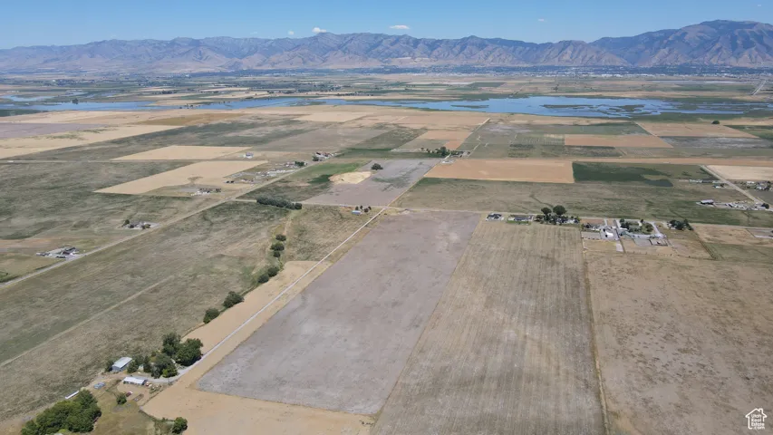 View of property location featuring a water and mountain view and rural landscape
