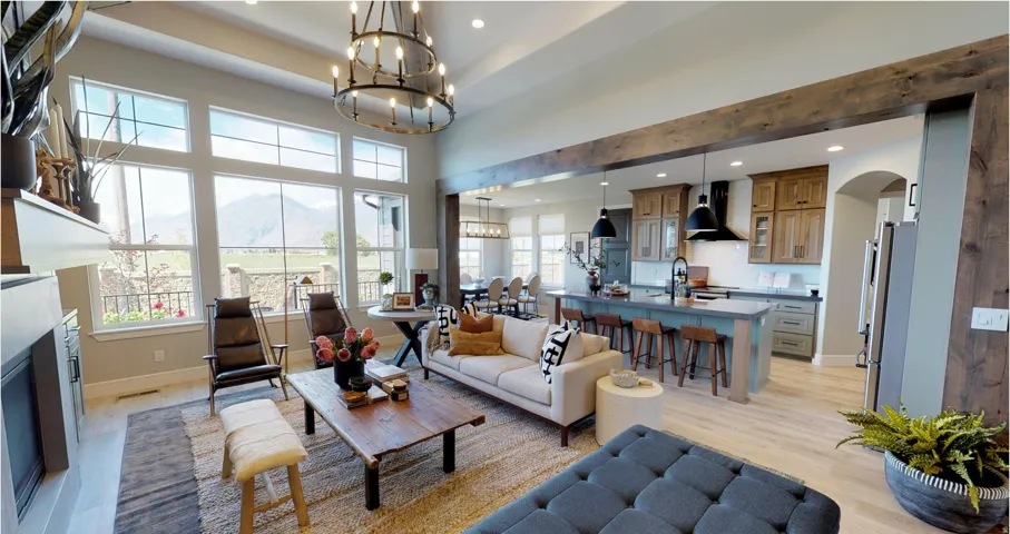 Living room featuring a fireplace, light wood-type flooring, recessed lighting, arched walkways, and a chandelier