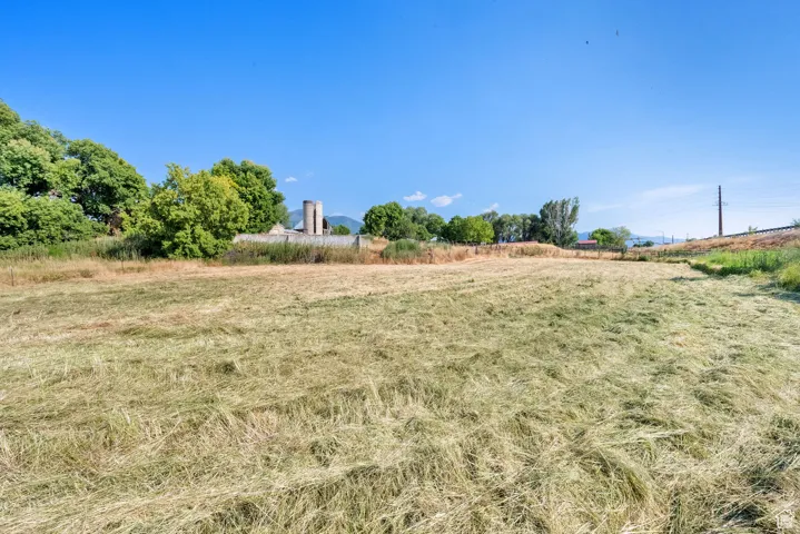 View of yard with a rural view