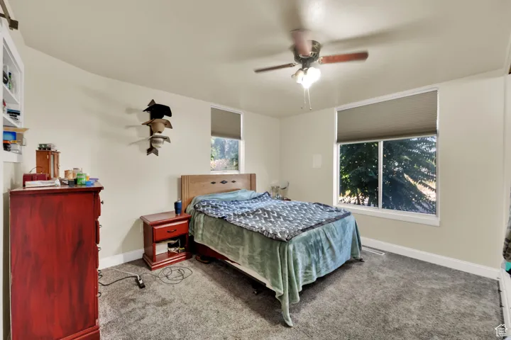 Bedroom featuring carpet flooring and ceiling fan