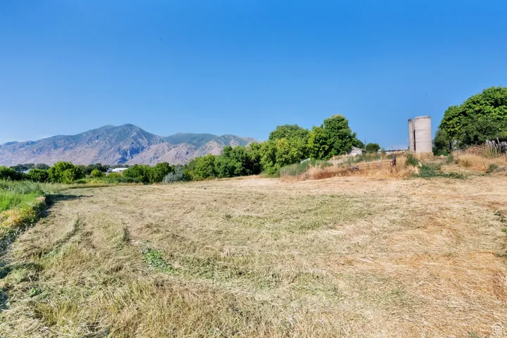 View of mountain backdrop with rural landscape