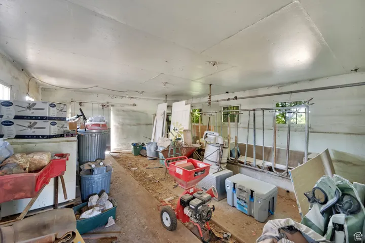 Misc room with healthy amount of natural light and unfinished concrete floors