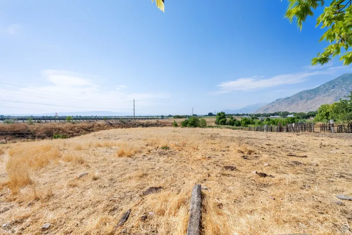 View of mountain backdrop with rural landscape
