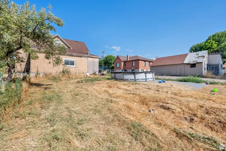 View of yard featuring a covered pool