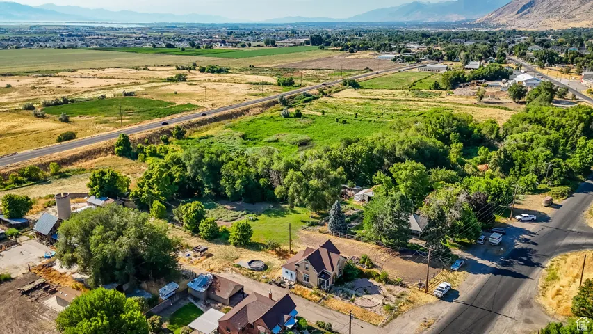 Aerial view of property's location with mountains and rural landscape
